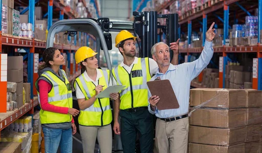 Internal Audit Ultimate Guide: Basic Practices to Future Trends 4 warehouse-manager-and-co-workers-discussing-istanbul-company-turkish-brand-internal-audit-risk-management