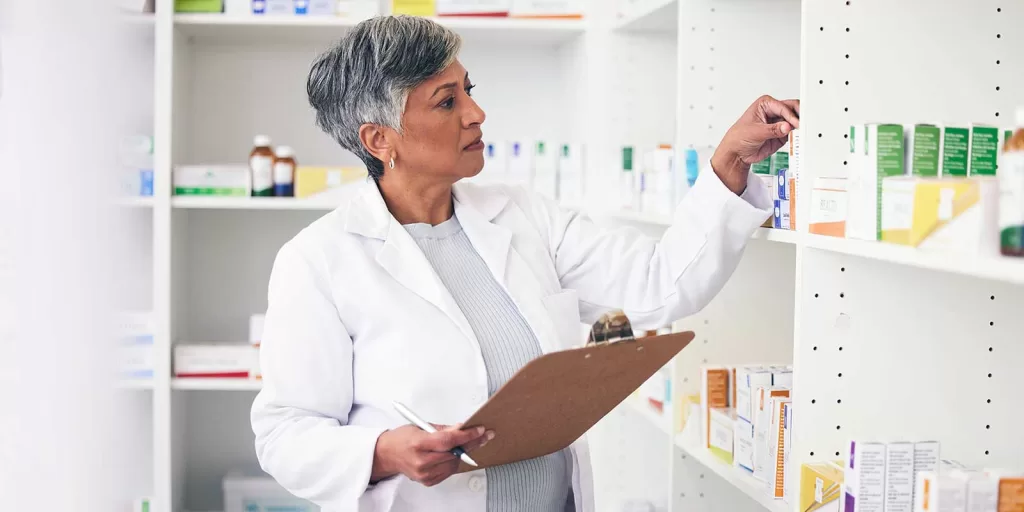 Mastering ERP Systems: The Ultimate Handbook 8 pharmacy-writing-and-clipboard-of-woman-with-medical-degree-for-inventory-management-and-data-entry-to-erp-software